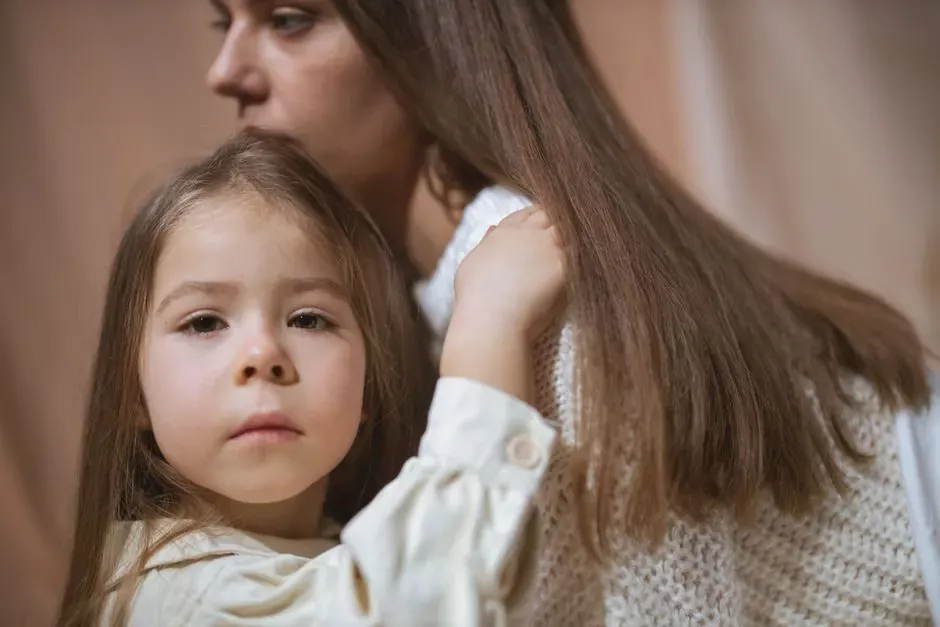 Tender moment between a mother and child embracing indoors, capturing love and connection.